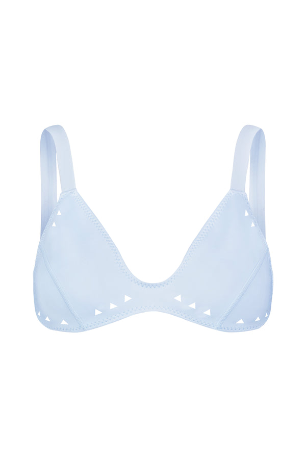 Discover the Georgia Top by Gigi C Bikinis from our Spring 2025 Collection. Its a light blue triangular bra featuring white accents on edges and straps, crafted from smooth scuba fabric with a minimalist design and no padding.